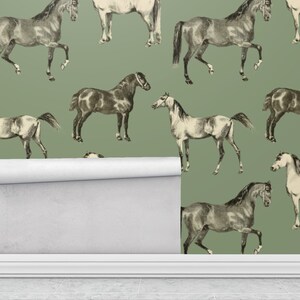 May include: A seamless pattern featuring a repeating design of black and white horses on a sage green background.