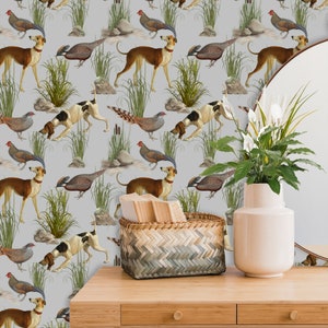 May include: A gray wallpaper with a repeating pattern of brown and white dogs, brown and white pheasants, and brown and white roosters. The wallpaper is displayed on a wooden table with a wicker basket and a white vase with a white plant.
