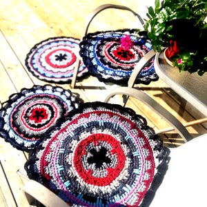Absolutely rustic rugs made from hand-woven yarn (60-63cm in diameter). Main color is dark fuchsia/grey.