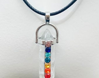 Dazzling Clear Quartz Crystal Pendant with Chakra Colour Crystal Embellishments In Front Alignment on a Waxed Cotton Necklace.