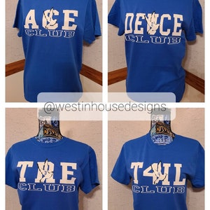 May include: Four blue t-shirts with white text and a white bird graphic. The shirts are labeled "ACE CLUB", "DEUCE CLUB", "TRE CLUB", and "T4IL CLUB".