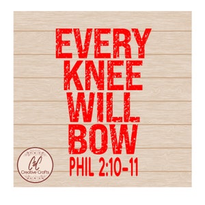 May include: A red text design on a light brown wood grain background. The text reads "EVERY KNEE WILL BOW PHIL 2:10-11". A circular logo with the text "Creative Crafts" is in the lower left corner.