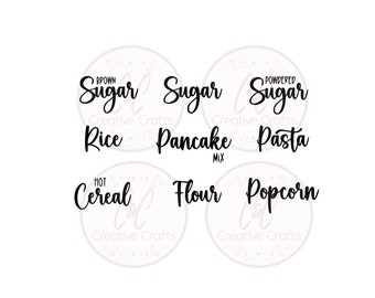 May include: Black and white text labels for kitchen canisters. The labels read "Brown Sugar", "Sugar", "Powdered Sugar", "Rice", "Pancake Mix", "Pasta", "Hot Cereal", "Flour", and "Popcorn".