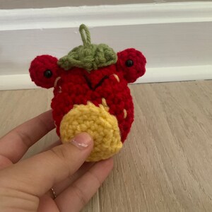 Adorable crocheted strawberry frog amigurumi plush!