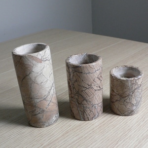 Vintage marble stone graduated cylindrical shape candle holders set of 3.Polished marble pillar earth tone colours tea light holders.