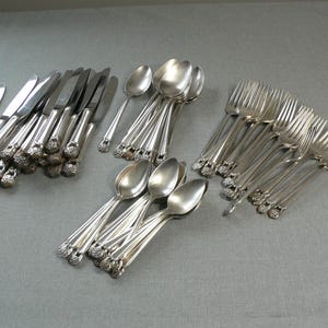 Eternally Yours 1847 Rogers Bros IS 69 pieces flatware silver plate.Ornate floral pierced handles collectible design retro dinner setting.
