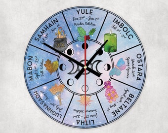 May include: A round, blue and white clock with a galaxy-like background. The clock face features the eight sabbats of the Wheel of the Year, with their corresponding dates and names. The clock hands are black and red.