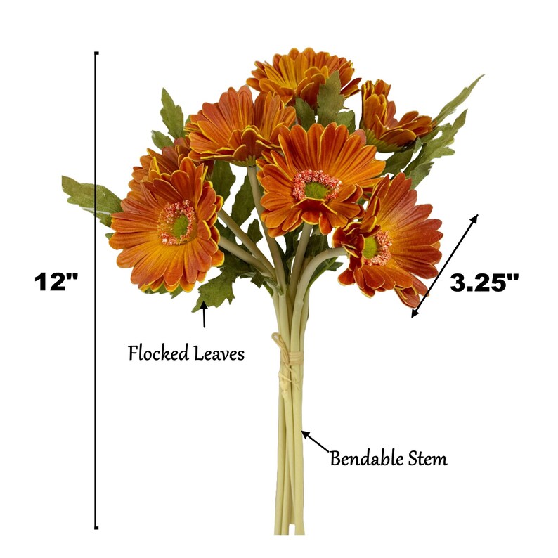 May include: A bouquet of 7 orange gerbera daisies with flocked leaves and bendable stems. The bouquet measures 12 inches tall and each flower head is 3.25 inches wide.