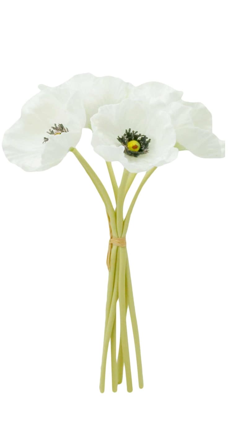 May include: A bouquet of five white silk poppy flowers with green stems tied together with a brown ribbon.
