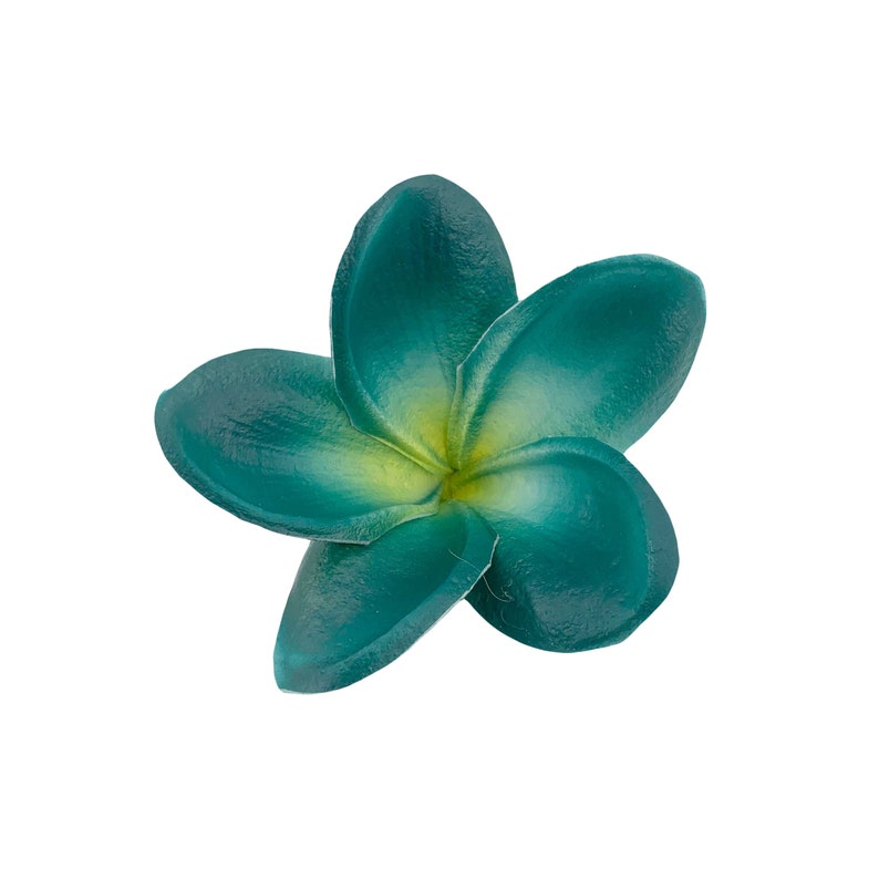 May include: A five-petaled plumeria flower with a smooth, matte texture. The petals transition from a deep teal color at the outer edges to a soft, pale yellow hue at the center, where the petals meet in a star-shaped arrangement.
