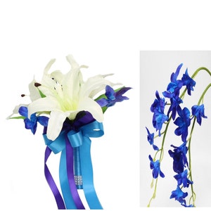 May include: A white lily and blue orchids bouquet with a blue and purple ribbon.