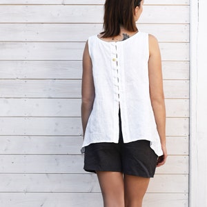 White linen top, sleeveless with buttons at the back.  Loose linen ladies shirt. 100%  linen, colours