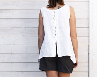 White linen top, sleeveless with buttons at the back.  Loose linen ladies shirt. 100%  linen, colours