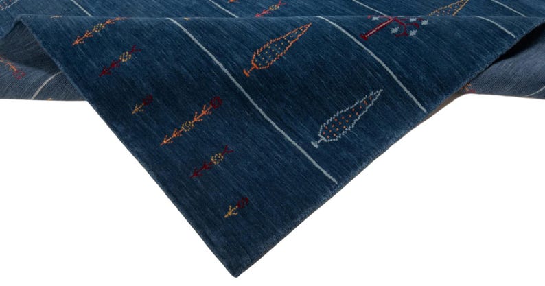 Folded edge exposing underside weave and neat finished edge, ideal for custom size wool area rug presentation