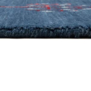Side profile shows slim 8x10 handmade wool rug thickness, flatwoven look and straight clean edge