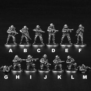 May include: A set of miniature metal soldier figurines in various poses, each holding a rifle. The figures are detailed with helmets and uniforms, and are labelled with letters A to M. The overall colour is a metallic grey.
