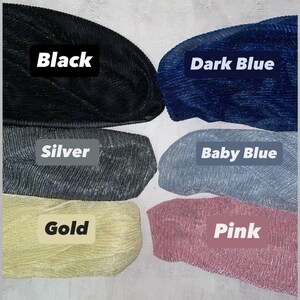 six different colored yarn balls, each labeled with a color name: Black, Dark Blue, Silver, Baby Blue, Gold, and Pink.