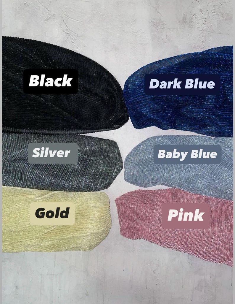six different colored yarn balls, each labeled with a color name: Black, Dark Blue, Silver, Baby Blue, Gold, and Pink.