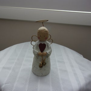 Vintage Angel With A Heart And Bells Figurine