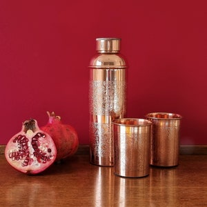 Engraved copper bottle with 2 copper glasses. Made of 100% copper set