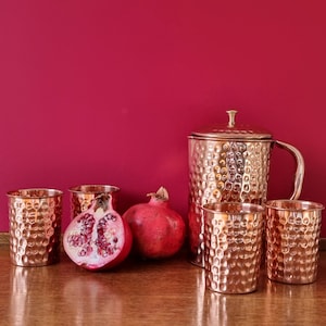 Quality copper jug with four copper glasses. Made of pure copper.