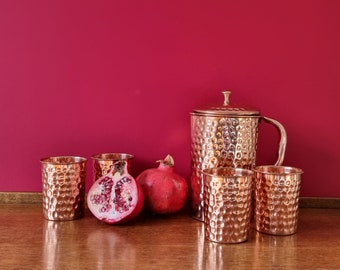 Quality copper jug with four copper glasses. Made of pure copper.