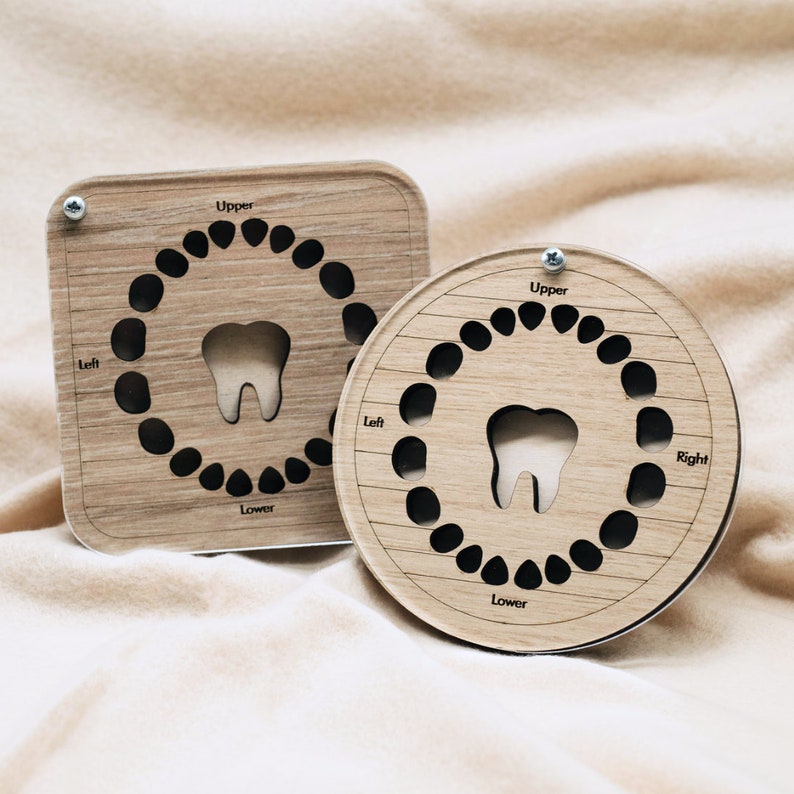 May include: Two wooden tooth charts with black circles representing teeth. The charts are labelled "Upper", "Lower", "Left", and "Right".