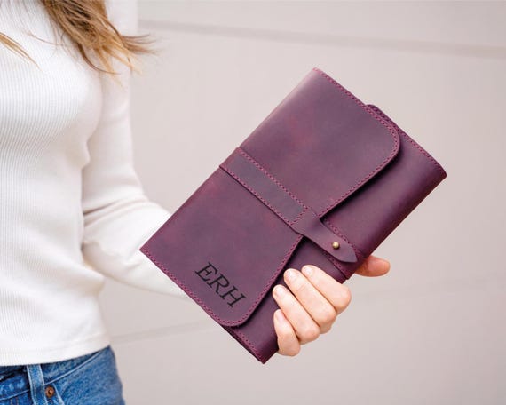 Refillable leather journal with custom monogram — the 'refillable' detail elevates this above a basic print-on-demand notebook into something genuinely giftable and long-lasting.