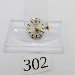 LÖPANDE Rolex Precision Cal. 1310 urverk, urtavla, visare, krona fungerar.