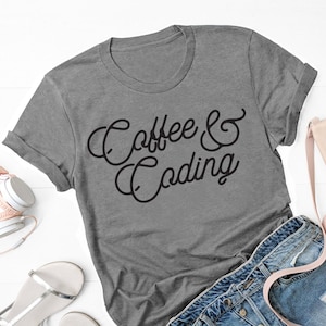 May include: A gray t-shirt with the text "Coffee & Coding" in black cursive lettering.