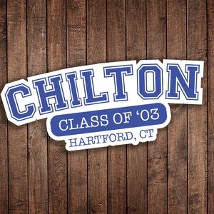 May include: A white and blue sticker with the word "CHILTON" in a bold, collegiate font. Below, it reads "CLASS OF '03" and "HARTFORD, CT" in a smaller font. The sticker is set against a wooden background.