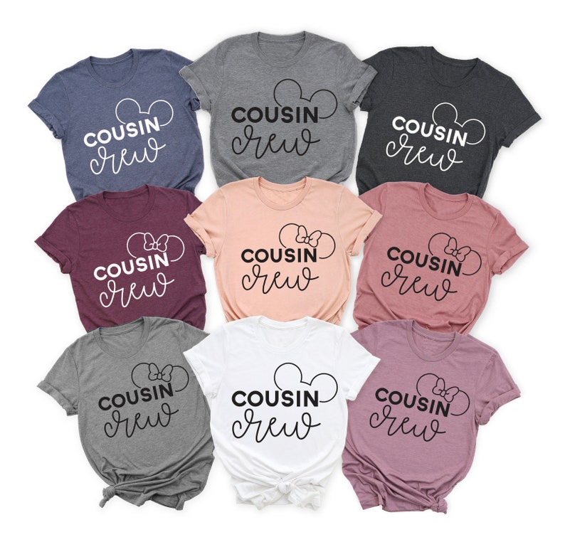 May include: Eight t-shirts in various colors with the text "COUSIN crew" in white and black lettering. The shirts feature a Mickey Mouse ear design and a bow.