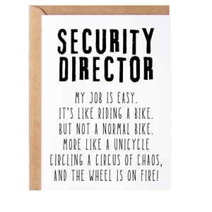 May include: A white card with black text that reads "SECURITY DIRECTOR" and a humorous description of the job as being like riding a unicycle in a circus of chaos with the wheel on fire.