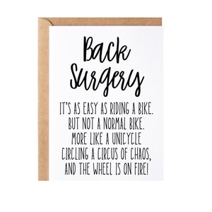 May include: A white card with black text that reads "Back Surgery" and a humorous caption about the difficulty of recovery. The caption reads: "It's as easy as riding a bike. But not a normal bike. More like a unicycle circling a circus of chaos, and the wheel is on fire!"