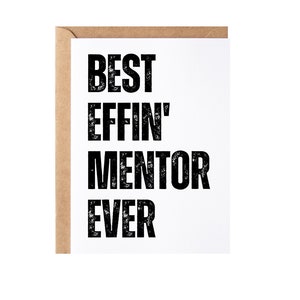 May include: White card with black text that reads "Best Effin' Mentor Ever". The card is surrounded by a brown envelope.