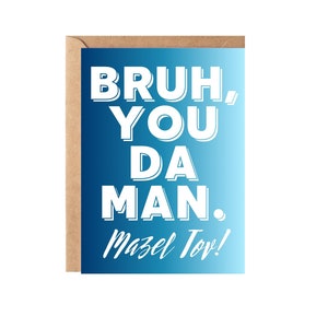 May include: A blue and white greeting card with the text "Bruh, you da man. Mazel Tov!"