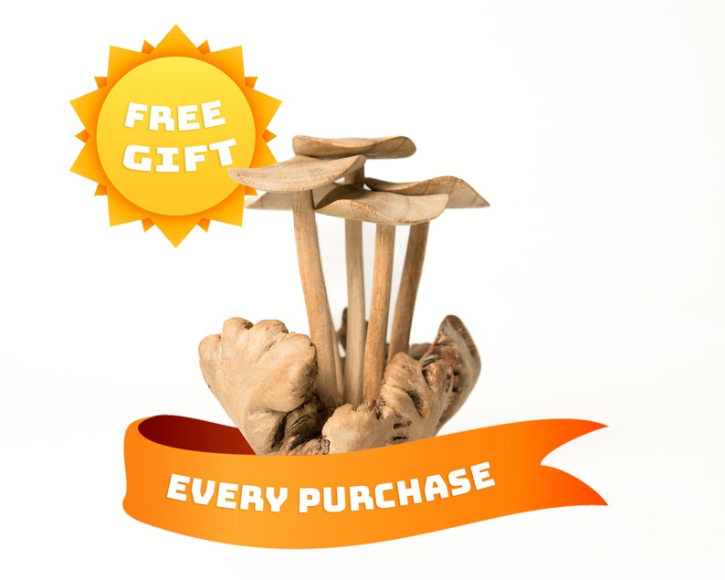 May include: A wooden mushroom-shaped decorative piece with a yellow ribbon that says "FREE GIFT EVERY PURCHASE".