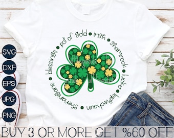 May include: A white t-shirt with a green shamrock design and the text "blessings on studio pot of gold. irish shamrock lucky leprechauns" around the shamrock.