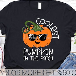 May include: A black t-shirt with a white graphic of a pumpkin wearing sunglasses and the text "Coolest Pumpkin in the Patch".