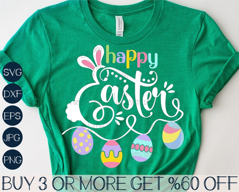 May include: Green t-shirt with a white bunny and the text "Happy Easter" in rainbow colors.  The bunny is holding a string of colorful Easter eggs.  The text "BUY 3 OR MORE GET %60 OFF" is at the bottom of the shirt.