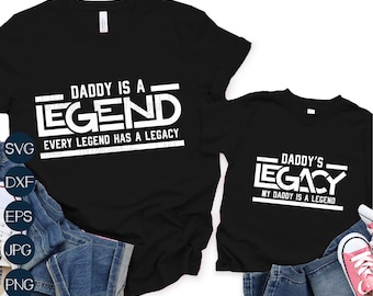 May include: Two black t-shirts with white text. The larger shirt says "Daddy is a Legend. Every legend has a legacy." The smaller shirt says "Daddy's Legacy. My Daddy is a Legend."