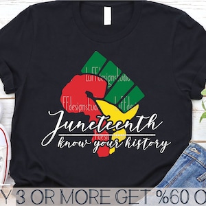 May include: Black t-shirt with a red, yellow, and green fist graphic and the text "Juneteenth know your history".