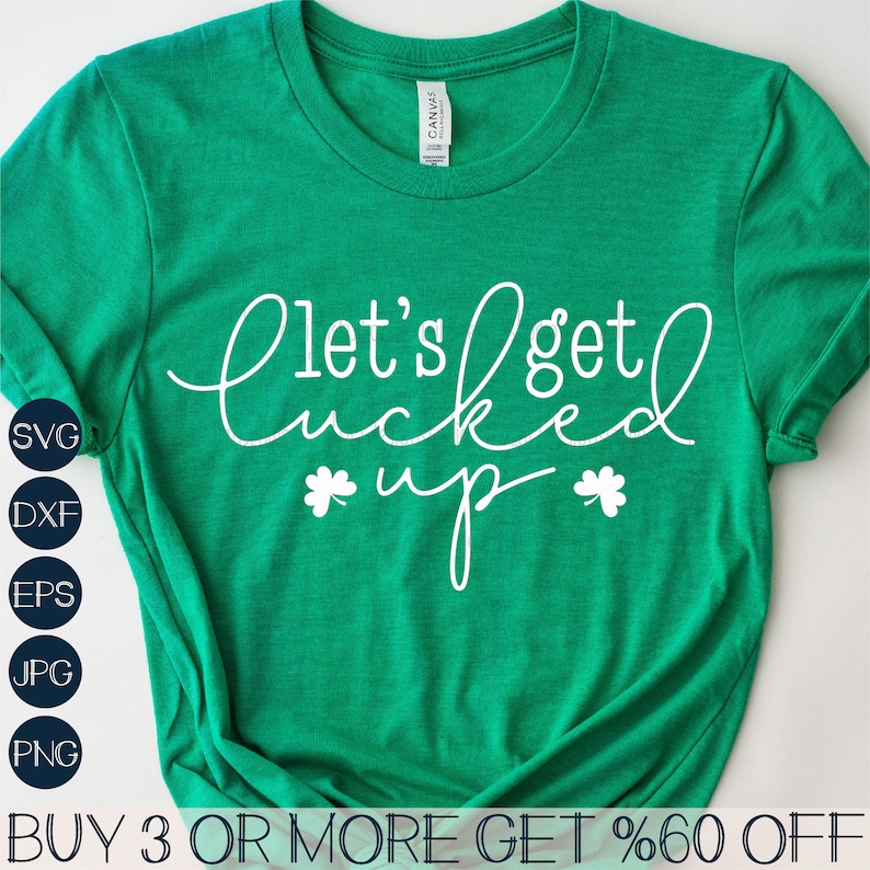 May include: Green t-shirt with white text that says "Let's get lucky up" with shamrock symbols on either side of the word "up".