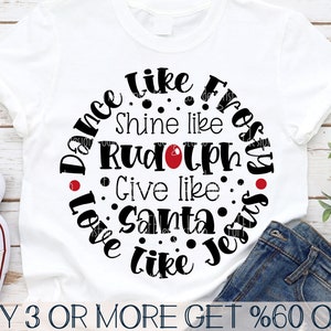 May include: White t-shirt with a black and red circle design that says "Dance like Frosty, Shine like Rudolph, Give like Santa, Love like Jesus".