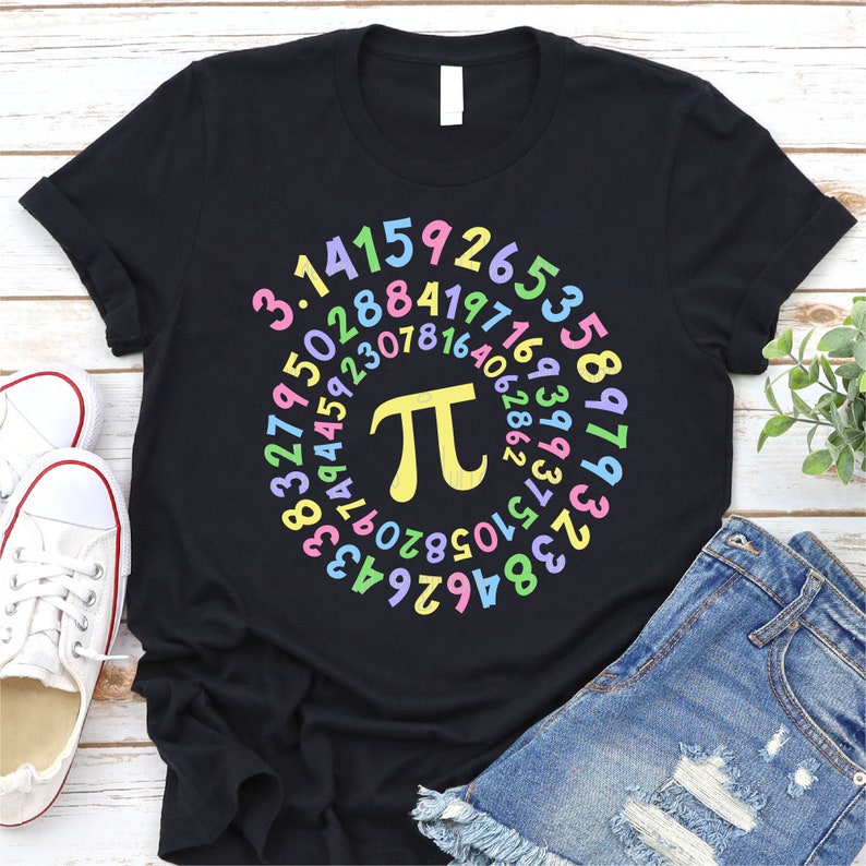 May include: Black t-shirt with a colorful circle of numbers representing the mathematical constant pi. The numbers are in a rainbow color scheme.
