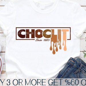 May include: A white t-shirt with the text "CHOCLIT Since 1865" in brown letters with dripping brown, tan, and peach colored paint.