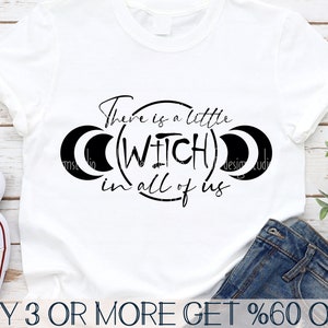 May include: A white t-shirt with black text that reads "There is a little (WITCH) in all of us". The text is surrounded by two crescent moons.