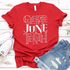 May include: Red t-shirt with white text that reads "Celebrate Juneteenth".
