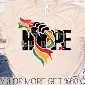 May include: A beige t-shirt with a black graphic of a fist holding a multi-colored ribbon with the word "HOPE" in black letters. The ribbon is red, yellow, and green.