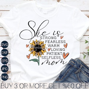 May include: White t-shirt with a sunflower graphic and the text "She is strong, fearless, warm, loving, patient, selfless mom".